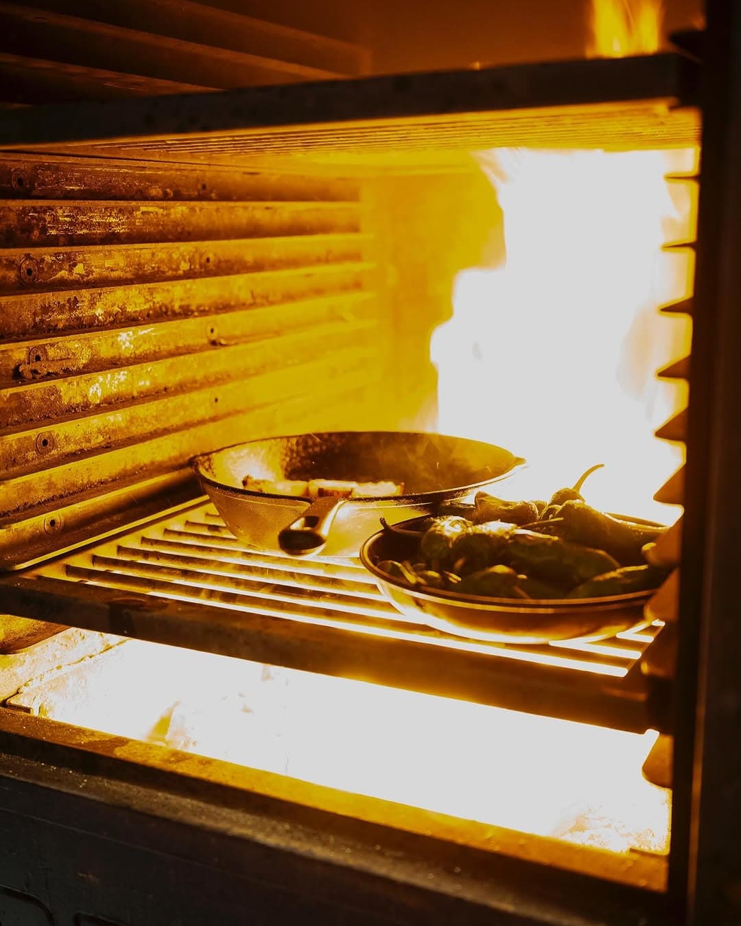 Inside the Bertha — flame with padrón peppers.