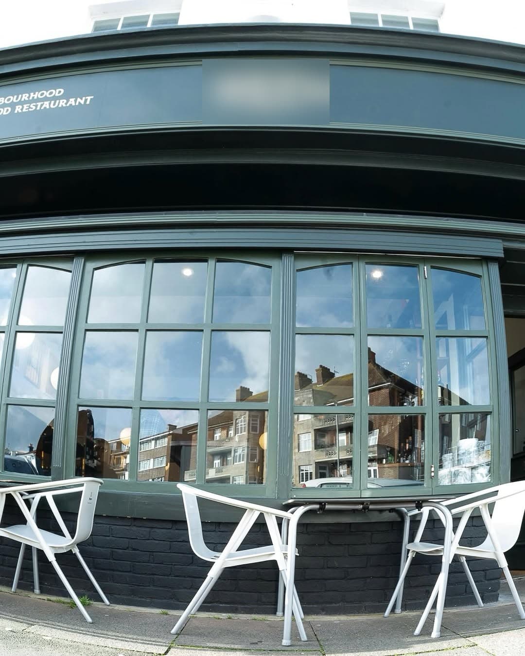 The Saltline & Ember shopfront — forest-green fascia with the hand-painted gold wordmark.